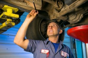 Ari working under a car